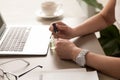 Businesswoman painting nails at office