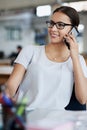 Businesswoman, phone call and smile at desk in office for talking, networking and discussion. Happiness, communication