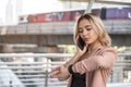 Businesswoman on phone check time at watch Royalty Free Stock Photo