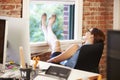 Businesswoman On Phone Relaxing In Modern Creative Office