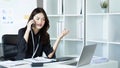 Businesswoman on the phone and using laptop at office. Businesswoman professional talking on mobile phone Royalty Free Stock Photo