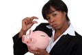 Businesswoman with a piggy bank Royalty Free Stock Photo