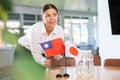 Businesswoman placing flags of Taiwan and Japan on negotiating table
