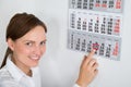 Businesswoman Placing Red Mark On Calendar Date Royalty Free Stock Photo