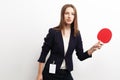 Businesswoman playing tennis over white background