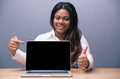 Businesswoman pointing on blank laptop screen Royalty Free Stock Photo