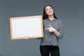 Businesswoman pointing finger on blank board Royalty Free Stock Photo