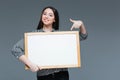 Businesswoman pointing finger on blank board Royalty Free Stock Photo