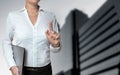 Businesswoman pointing with finger concept