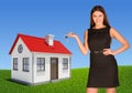 Businesswoman pointing at house, showing key Royalty Free Stock Photo