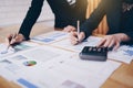 Businesswoman pointing pen on business document at meeting room. Discussion and analysis data charts and graphs showing the Royalty Free Stock Photo