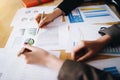 Businesswoman pointing pen on business document at meeting room.Discussion and analysis data charts and graphs showing the results Royalty Free Stock Photo