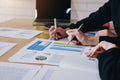 Businesswoman pointing pen on business document at meeting room.Discussion and analysis data charts and graphs showing the results Royalty Free Stock Photo