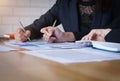 Businesswoman pointing pen on business document at meeting room.Discussion and analysis data charts and graphs showing the results Royalty Free Stock Photo