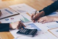 Businesswoman pointing pen on business document at meeting room.Discussion and analysis data charts and graphs showing the results Royalty Free Stock Photo