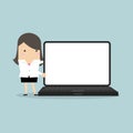 Businesswoman pointing to laptop display. Royalty Free Stock Photo