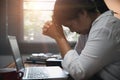 Businesswoman Praying with Eyes Closed. Businesswoman with her hands folded waiting for good news sitting at workplace at the Royalty Free Stock Photo