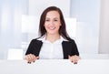 Businesswoman presenting blank billboard