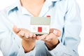 Businesswoman presenting a house model. Royalty Free Stock Photo