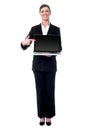 Businesswoman presenting new laptop Royalty Free Stock Photo