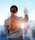 Businesswoman pressing buttons on line chart