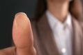 Businesswoman pressing control glass of biometric fingerprint scanner, closeup. Royalty Free Stock Photo