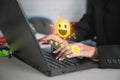 Businesswoman pressing face emoticon on the keyboard laptop .Customer service evaluation concept Royalty Free Stock Photo