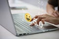 Businesswoman pressing face emoticon on the keyboard laptop .Customer service evaluation concept Royalty Free Stock Photo