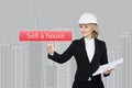 Businesswoman pressing sell a hause button on virtual screens Royalty Free Stock Photo