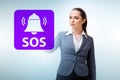 Businesswoman pressing SOS button in case of danger Royalty Free Stock Photo