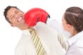 Businesswoman punching businessman with boxing gloves Royalty Free Stock Photo