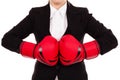 Businesswoman punching red boxing gloves together ready to figh Royalty Free Stock Photo
