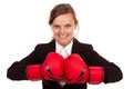 Businesswoman punching red boxing gloves together ready to fight Royalty Free Stock Photo