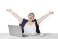 Businesswoman raising hands in studio Royalty Free Stock Photo