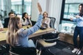 Businesswoman raising her hand to ask the question on a seminar in board room Royalty Free Stock Photo