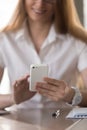 Businesswoman reading message on modern cellphone Royalty Free Stock Photo