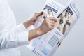 Businesswoman reading newspaper on gray background Royalty Free Stock Photo