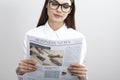 Businesswoman reading newspaper on gray background Royalty Free Stock Photo