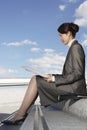 Businesswoman Reading Newspaper Outdoors Royalty Free Stock Photo