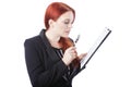 Businesswoman Reading Report with Magnifying Glass Royalty Free Stock Photo