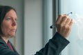 Businesswoman ready to write on office whiteboard Royalty Free Stock Photo