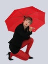 Businesswoman with a red umbrella