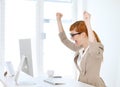 Businesswoman rejoiced in her office Royalty Free Stock Photo