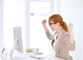 Businesswoman rejoiced in her office Royalty Free Stock Photo