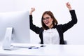 Businesswoman rejoicing at her success cheering