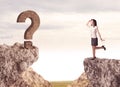 Businesswoman on rock mountain with a question mark Royalty Free Stock Photo