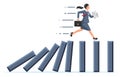 Businesswoman running away from falling domino.