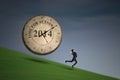 Businesswoman running with big time clock Royalty Free Stock Photo