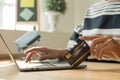 The businesswoman`s hand is holding a credit card and using a laptop for online shopping and internet payment Royalty Free Stock Photo