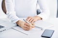 Businesswoman`s hand holding pen and writing something Royalty Free Stock Photo